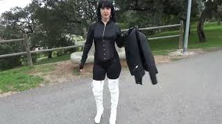 Victoria Devil. Walking Black Sexy Catsuit, Black Corset, White High Heels Boots And Sexy Smoking.
