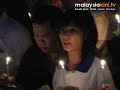 Death plunge: Candles flicker in mourning