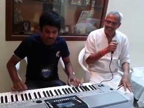 pranav s playing keyboard Radhakrishna Naickji singing Guru...