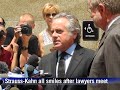 Strauss-Kahn all smiles, as prosecutors say case goes on