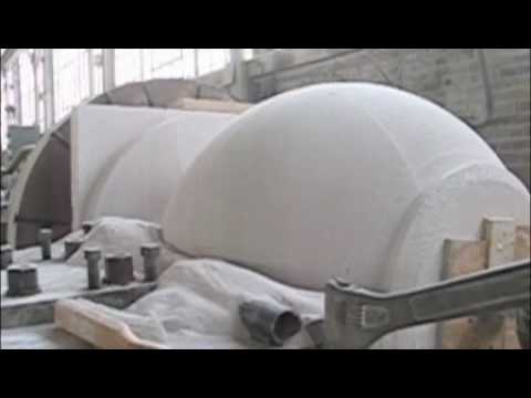 A block of Autoclaved Aerated Concrete AAC is turned on a lathe to make a 