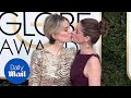 Sealed with a kiss! BFFs Sarah Paulson & Amanda Peet at Globes - Daily Mail