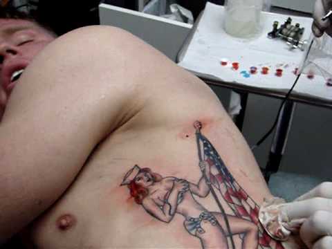 Pin-Up Girl At The Tattoo Shop-OUCH THAT HURTS!