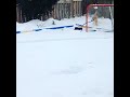 Elsa shoveling the hockey rink.