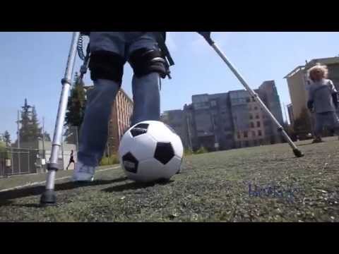 Persons with Spinal Cord Injury playing soccer while wearing Berkeley Exoskeleton