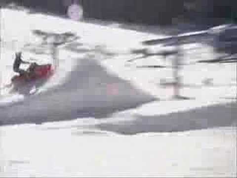 Polaris Snowmobile Jumping. Pro Rider Jumps a snowmobile a