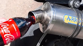 Pouring Coca Cola In A Motorcycle Exhaust