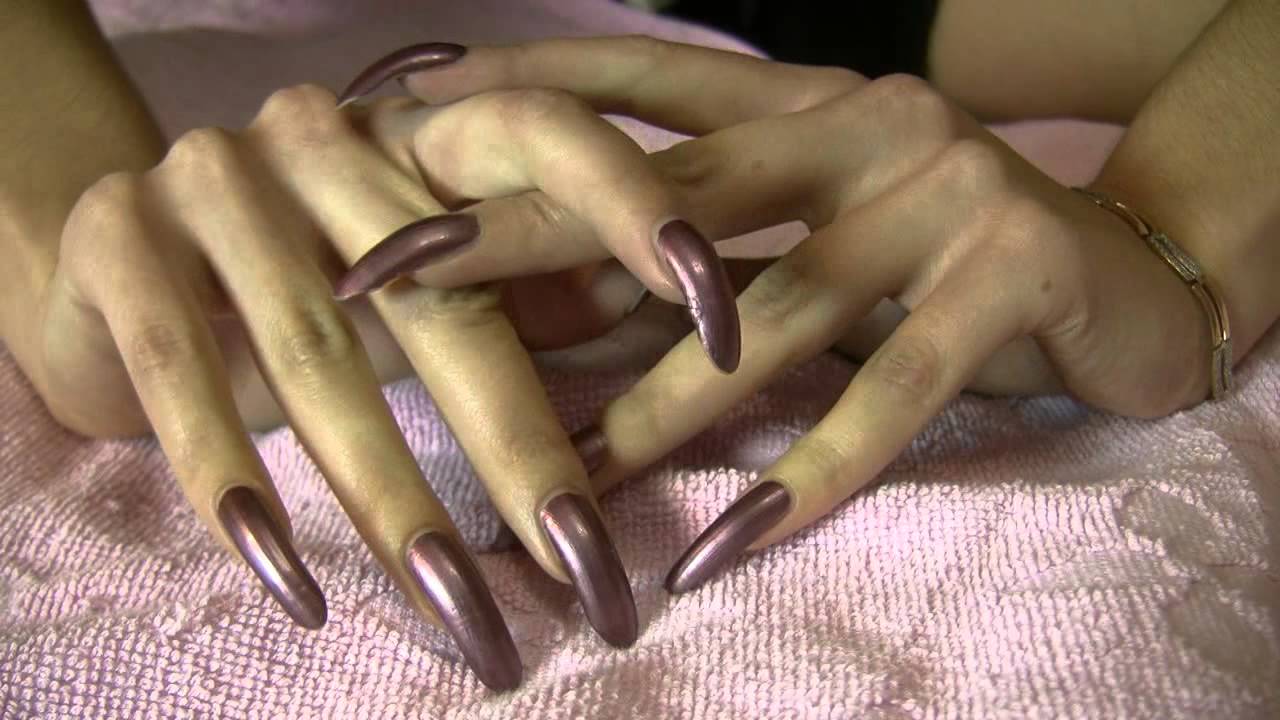 Back scratching with long pink nails