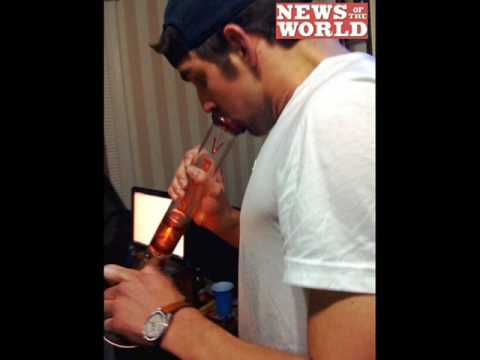 Michael Phelps smoking a cigarette (or weed)
