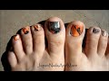 Black and Orange Water Marble For Toes Design