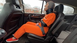 A Jumpsuit, Posture Collar, Handcuffs, Stocking Cap, Seat Belted Car Ride For Marie