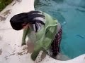 Wetlook sexy girl jumps in pool with her clothes on