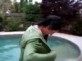 Wetlook sexy girl jumps in pool with her clothes on