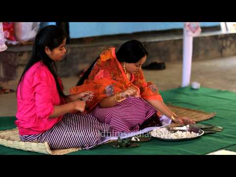 Manipuri bride making garland for wedding