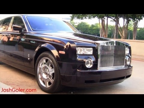 Video of a great luxury car combo A black Rolls Royce Phantom and a Black 