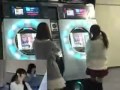 Danceroid members Kozue and Yuzuki playing on maimai