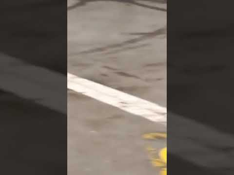 Rainstorm Creates Dramatic Scene Outside Factory Door - 1214699