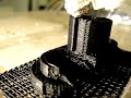 My RepRap 3D printer printing itself an upgrade (Bowden extruder clip)