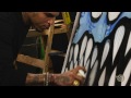 Chris Brown does spray paint art at HOT 97 studios?