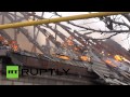 RAW: Houses burn down after shelling hits Donetsk