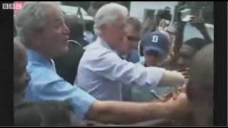 George Bush Handshake With A Haitian, Then Wipes His Hand On Bill Clinton
