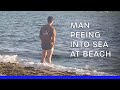 SHOCKING! Man PEEING into English Bay waters in front of everyone!