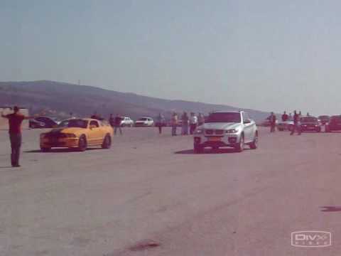 BMW X6 2009 vs Mustang Shelby GT 500