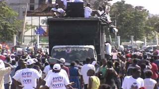 Angry Demonstrators Demand Sarkozy To Pay Up And Return Aristide To Haiti