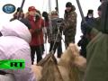 Putin hugs & tags giant polar bear in Arctic