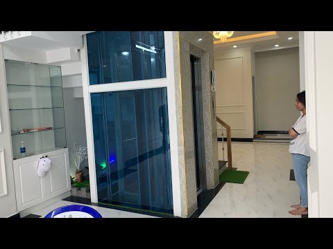 Thang máy vách kính tiết kiệm không gian cho nhà ở | thang máy nhỏ nhất - Kho Tư liệu Xây dựng