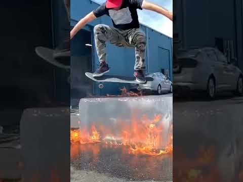 Skateboarding over fire and fire