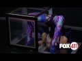 Two Big Apple Circus contortionists squeeze into a small box