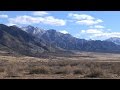 Clouds And Mountains Tower Over A Barren Desert Landscape Skull Valley Timelapse. Stock Footage