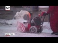 Raw: Workers Begin Clearing Snow in Times Square