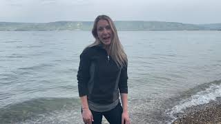 Christians clean up trash on the shores of the Sea of Galilee