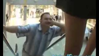 Naked And Funny. Surprise On An Escalator