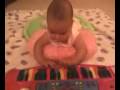 Suzuki method: Baby (4 months old) playing with colored keys