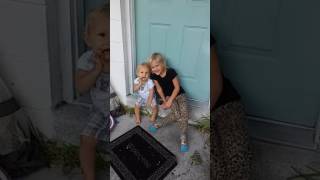 Brother And Sister Sitting Outside
