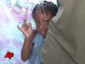 Haiti Quake Survivors Scratch by in Camp