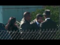 Whitney Houston Funeral - Bobby Brown comforts friend at funeral