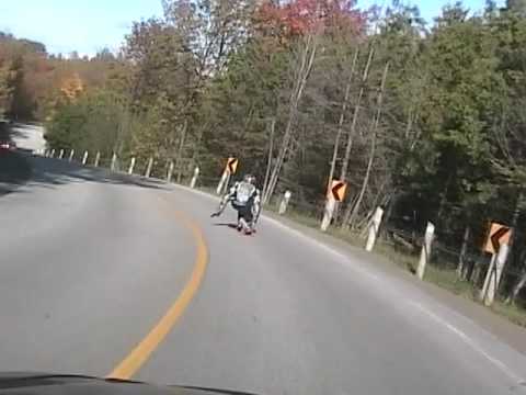 Noshow Bombing Creemore on a Longboard