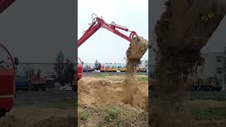 Powerful Excavator Working In Action Heavy Machinery At Construction Site