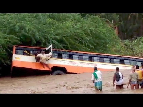Bus accident, passenger bus in flood water, bus accident in floods passenger escape video, perundhu aditthu sellum katchi, news videos in tamil,