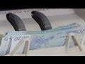 ECB holds interest rates, forecasts grim 2013