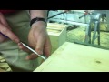 Finishing chiseling out the dovetails on the bee brood box