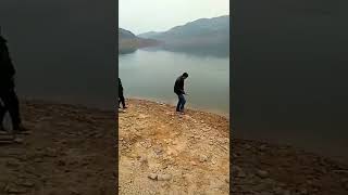 Kid Throws Rock Into His Dad