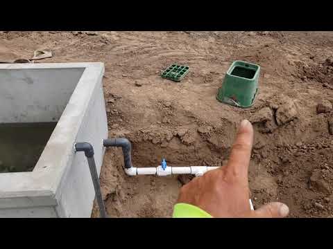 Installation of 300 gallon concrete water trough with wildlife escape ramp