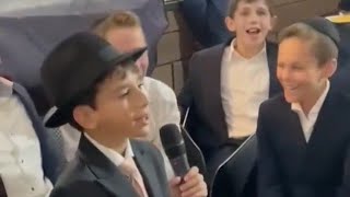 Bar Mitzvah Bucher Singing With His Classmates At his Bar Mitzvah Celebration