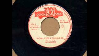 Watch Ini Kamoze Trouble You A Trouble Me video