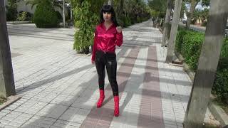 Victoria Devil Walking In Sexy Leather Black Leggings, Red Silk Blouse And Red High Heels..